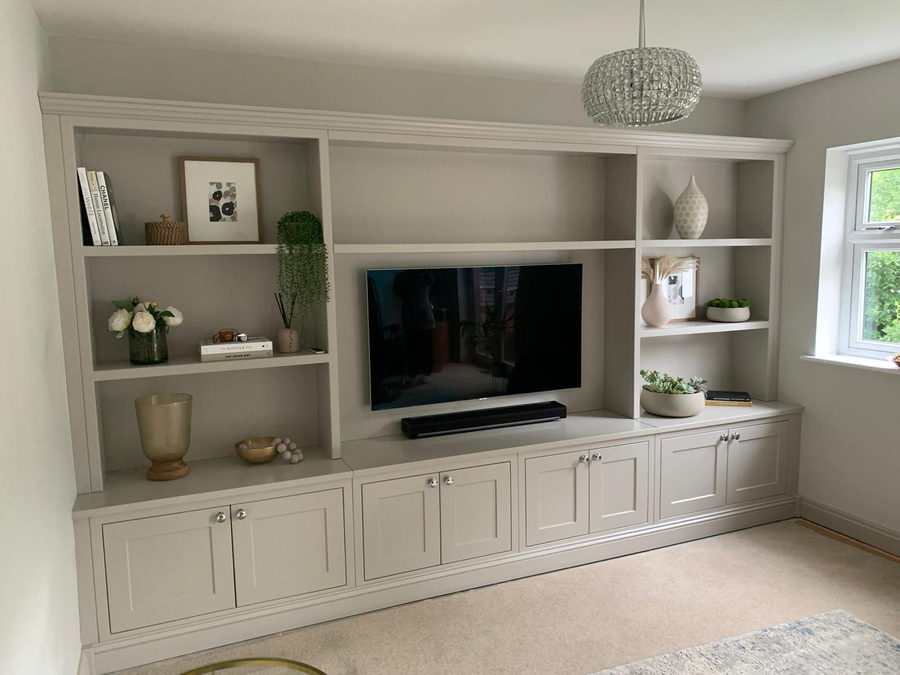 Daylight on a greige shaker media wall, shelf lighting off